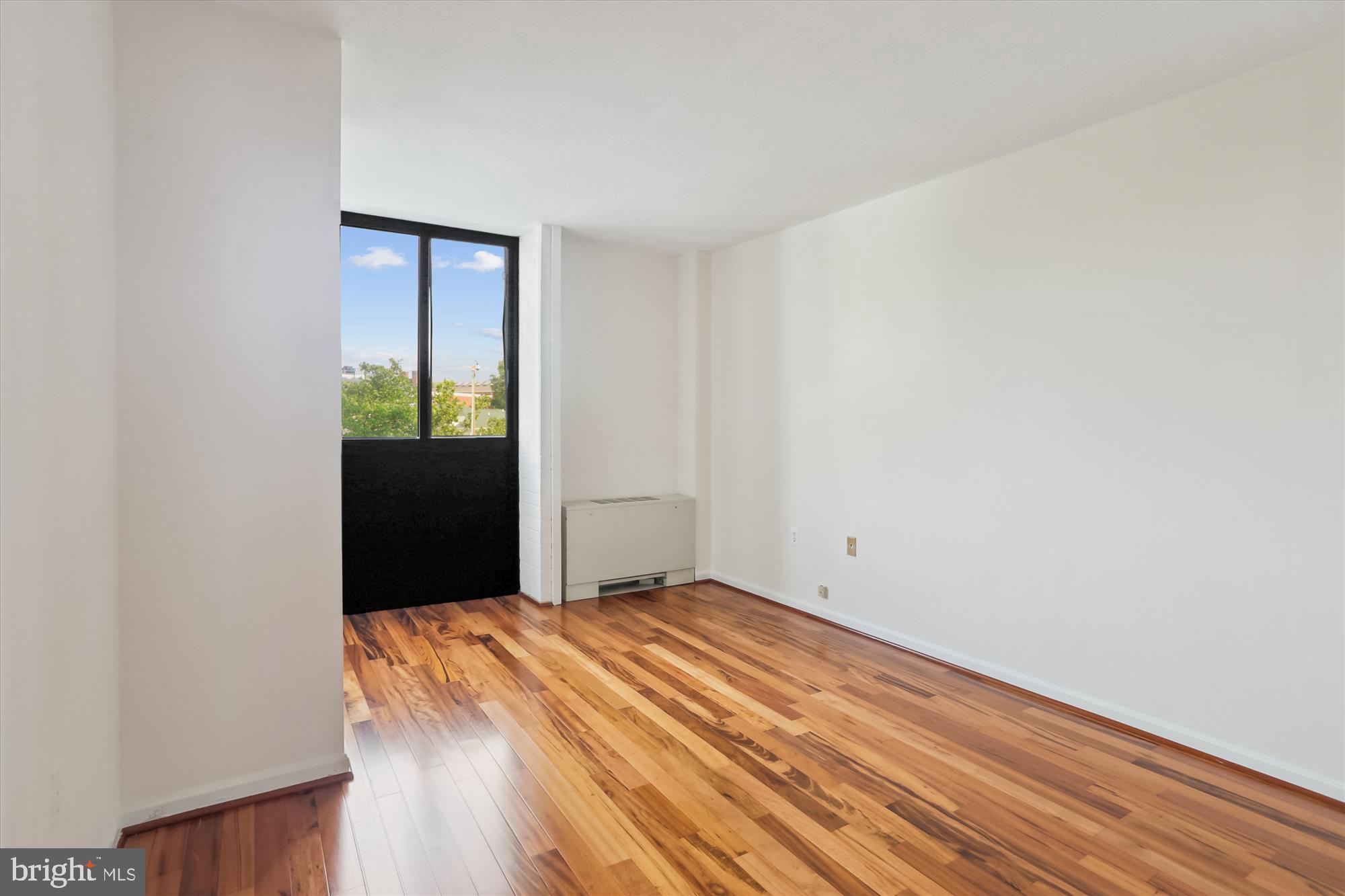 4242 East-West Highway, Unit 414 Chevy Chase, MD 20815 - Photo 22 of 66 a view of a room with wooden floor
