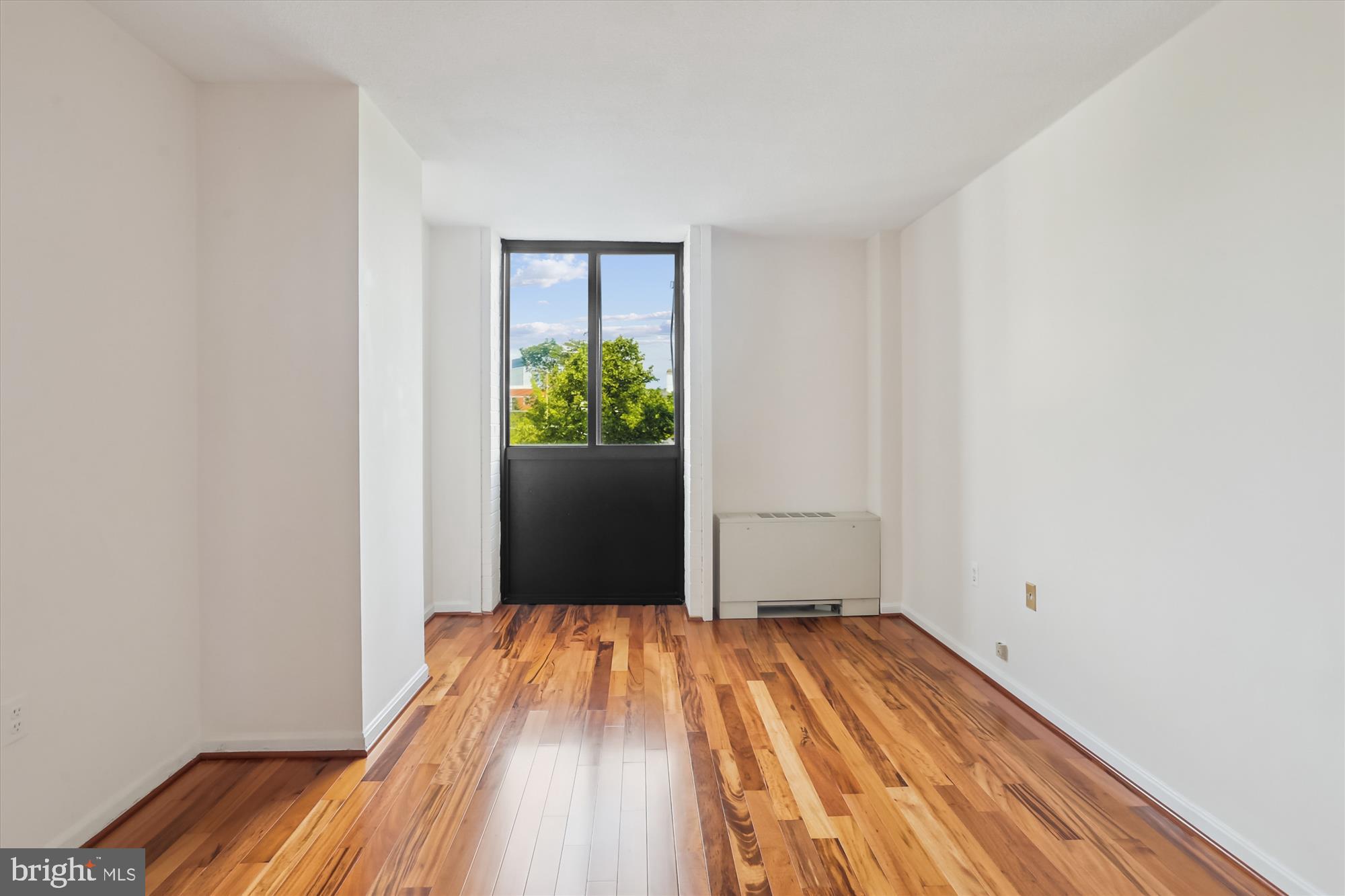 4242 East-West Highway, Unit 414 Chevy Chase, MD 20815 - Photo 24 of 66 a view of a room with wooden floor