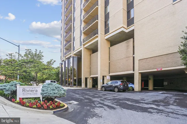 a kitchen with stainless steel appliances granite countertop a sink a stove and a microwave