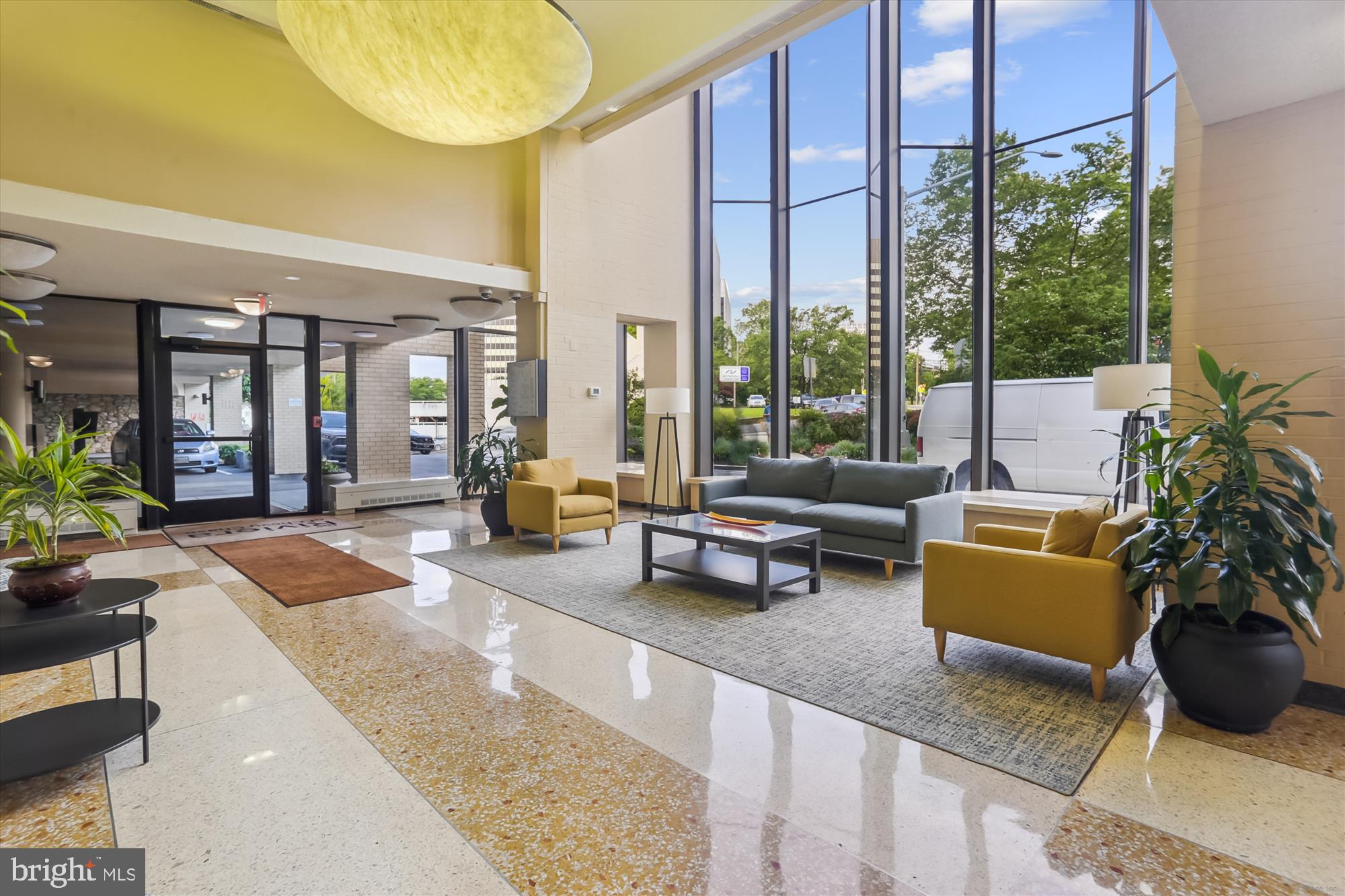 4242 East-West Highway, Unit 414 Chevy Chase, MD 20815 - Photo 39 of 66 a living room filled with furniture