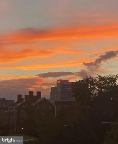 a view of a small space with wooden floor and a bathroom