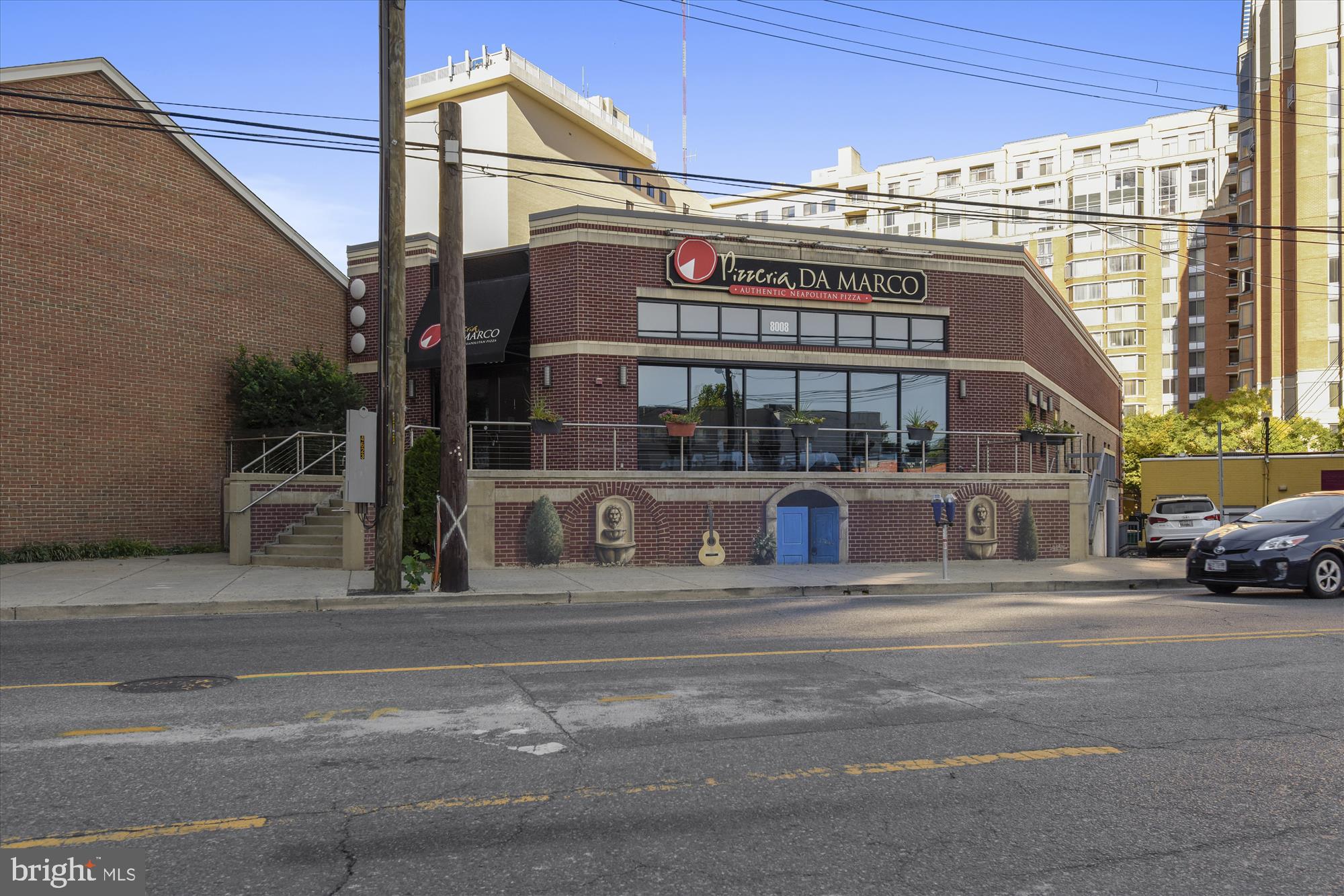 4242 East-West Highway, Unit 414 Chevy Chase, MD 20815 - Photo 64 of 66 a building with a sign on the side of it