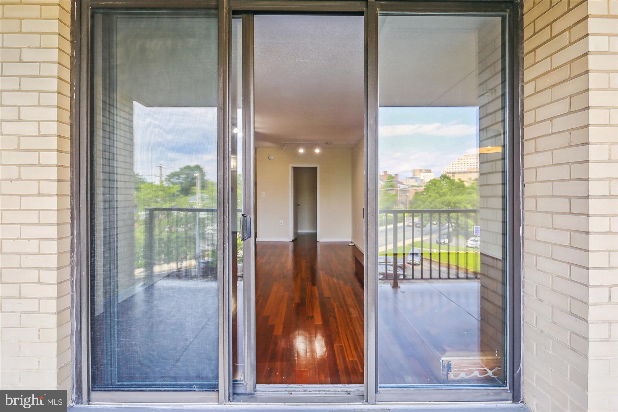 4242 East-West Highway, Unit 414 Chevy Chase, MD 20815 - Photo 9 of 66 Floor to Ceiling Doors to balcony.