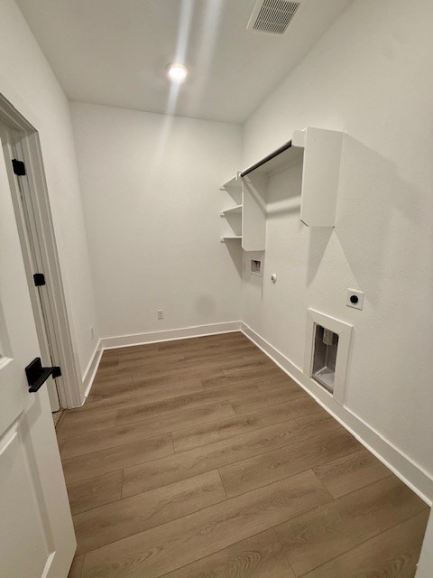 121 Prodigal Way Kyle, TX 78640 - Photo 11 of 12 wooden floor in an empty room