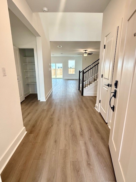 121 Prodigal Way Kyle, TX 78640 - Photo 2 of 12 a view of a room with wooden floor and stairs
