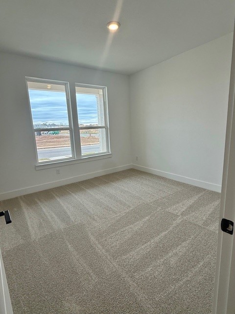 121 Prodigal Way Kyle, TX 78640 - Photo 3 of 12 an empty room with a window