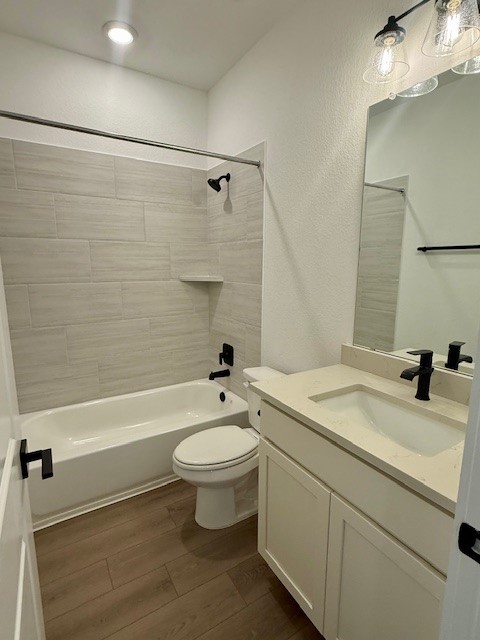 121 Prodigal Way Kyle, TX 78640 - Photo 4 of 12 a bathroom with a sink toilet a mirror and shower