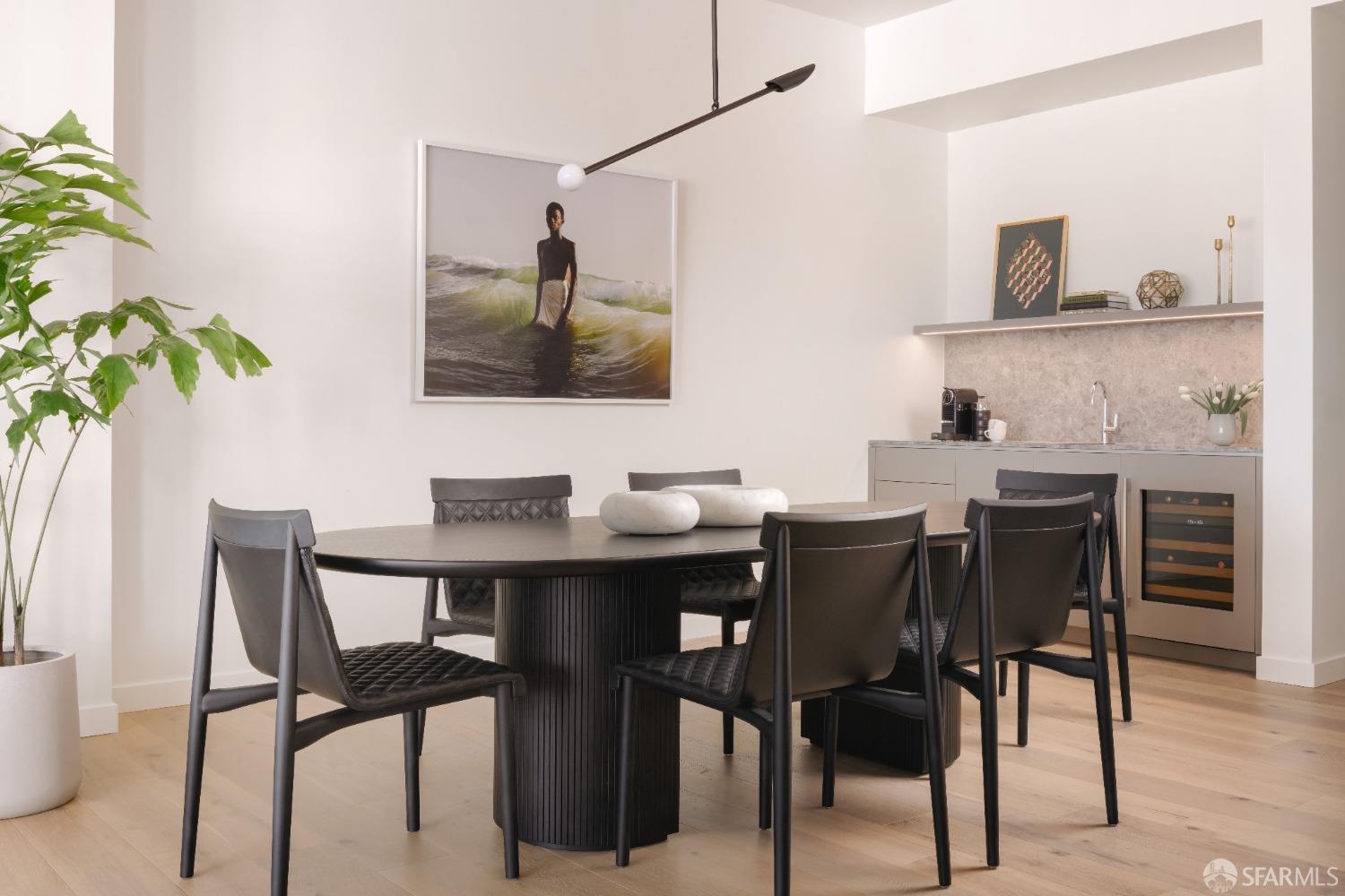 36 Meadow Drive, Unit 202 San Francisco, CA 94130 - Photo 11 of 50 a view of a dining room with furniture and wooden floor