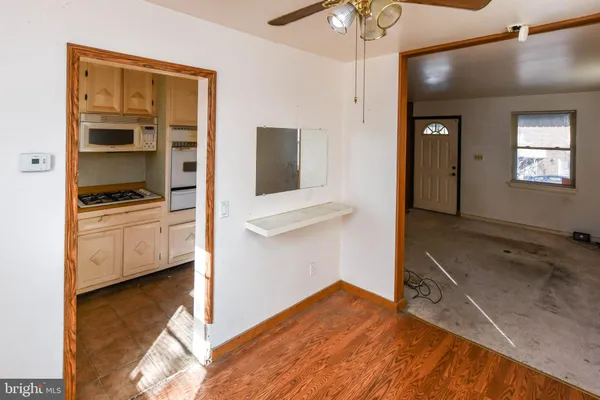 a view of a kitchen cabinets and a wooden floor