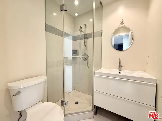 a bedroom with a bed and a table