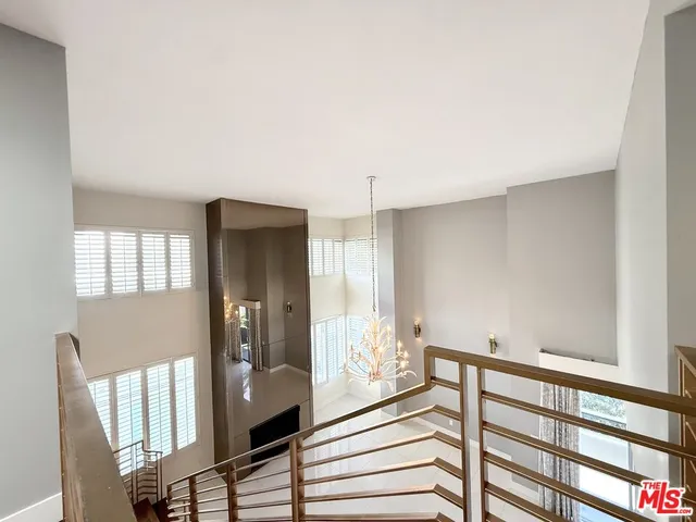 a bedroom with a bed and a mirror