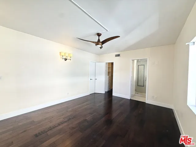 a bathroom with a sink a mirror and a shower