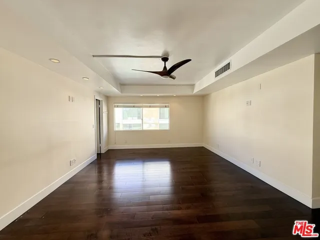 a bathroom with a granite countertop sink a mirror a shower and a bathtub