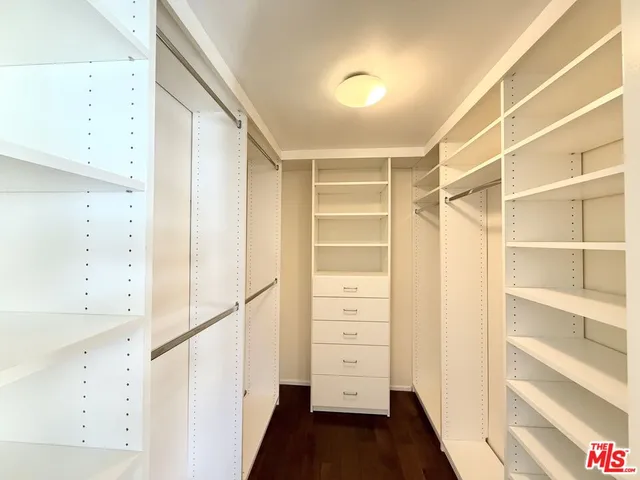a spacious bathroom with a tub double sink and shower