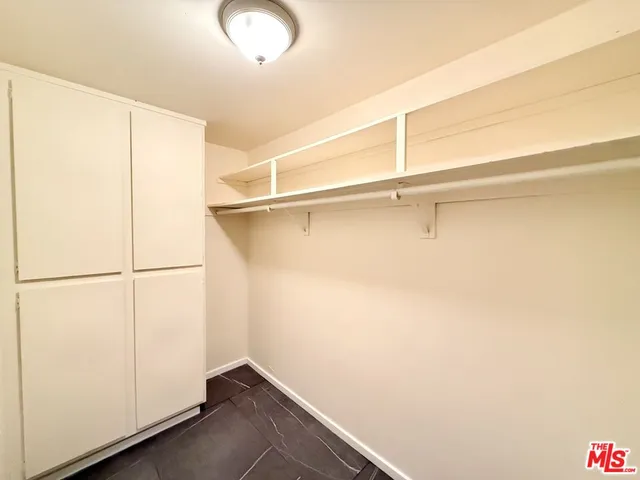 a view of closet area with empty racks