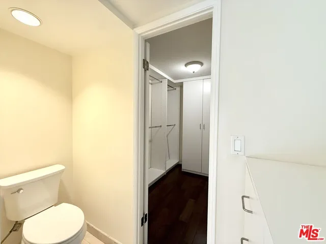 a open kitchen with stainless steel appliances granite countertop a refrigerator and a sink