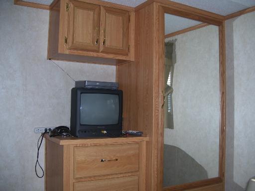 509 La Moille Road, Unit 2408 Sublette, IL 61367 - Photo 5 of 14 a living room with furniture and a flat screen tv