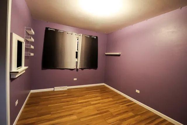 a view of a livingroom with wooden floor