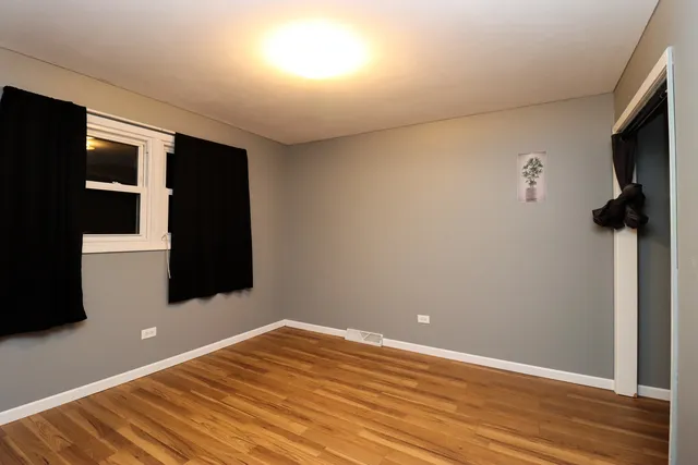 a view of hallway with wooden floor