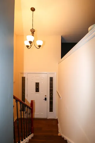 an entryway with a white door