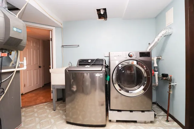 a bathroom with a sink a toilet and a shower