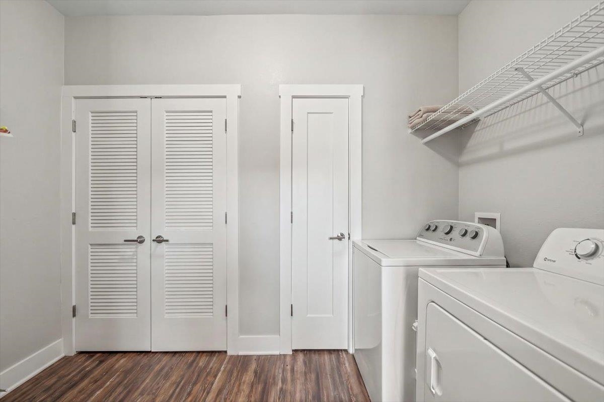 415 Abbey Road, Unit D Munford, TN 38058 - Photo 17 of 35 Dedicated laundry area featuring wood-finish flooring and light gray walls