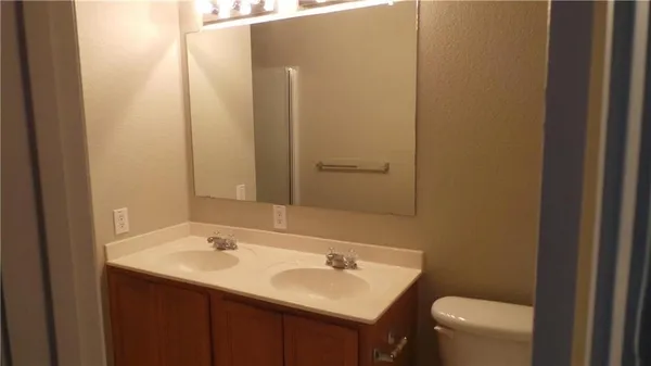 a bathroom with a sink and a toilet