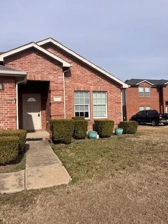 a view of a house with a yard and garage