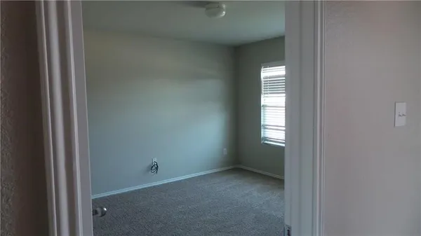 a view of an empty room and window