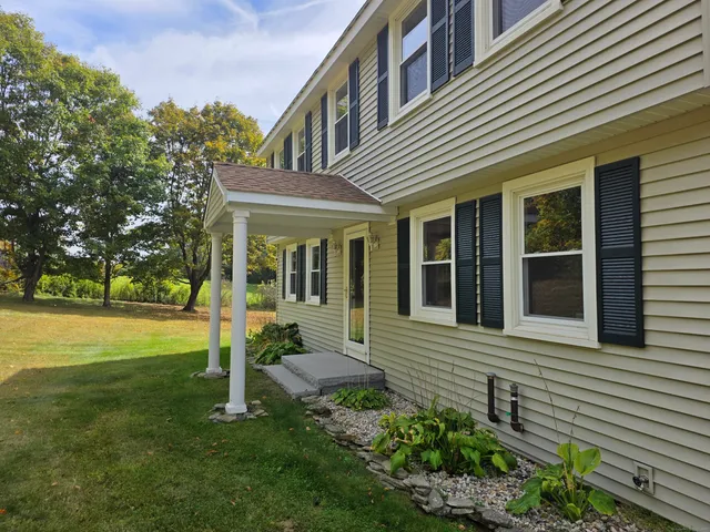 a view of a house with a garden