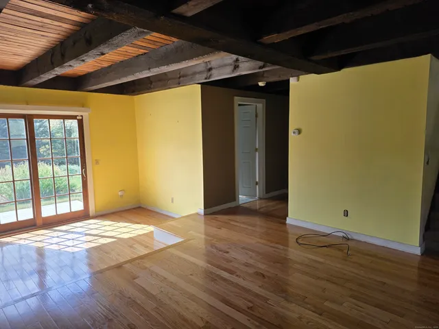 a kitchen with a sink window and cabinets