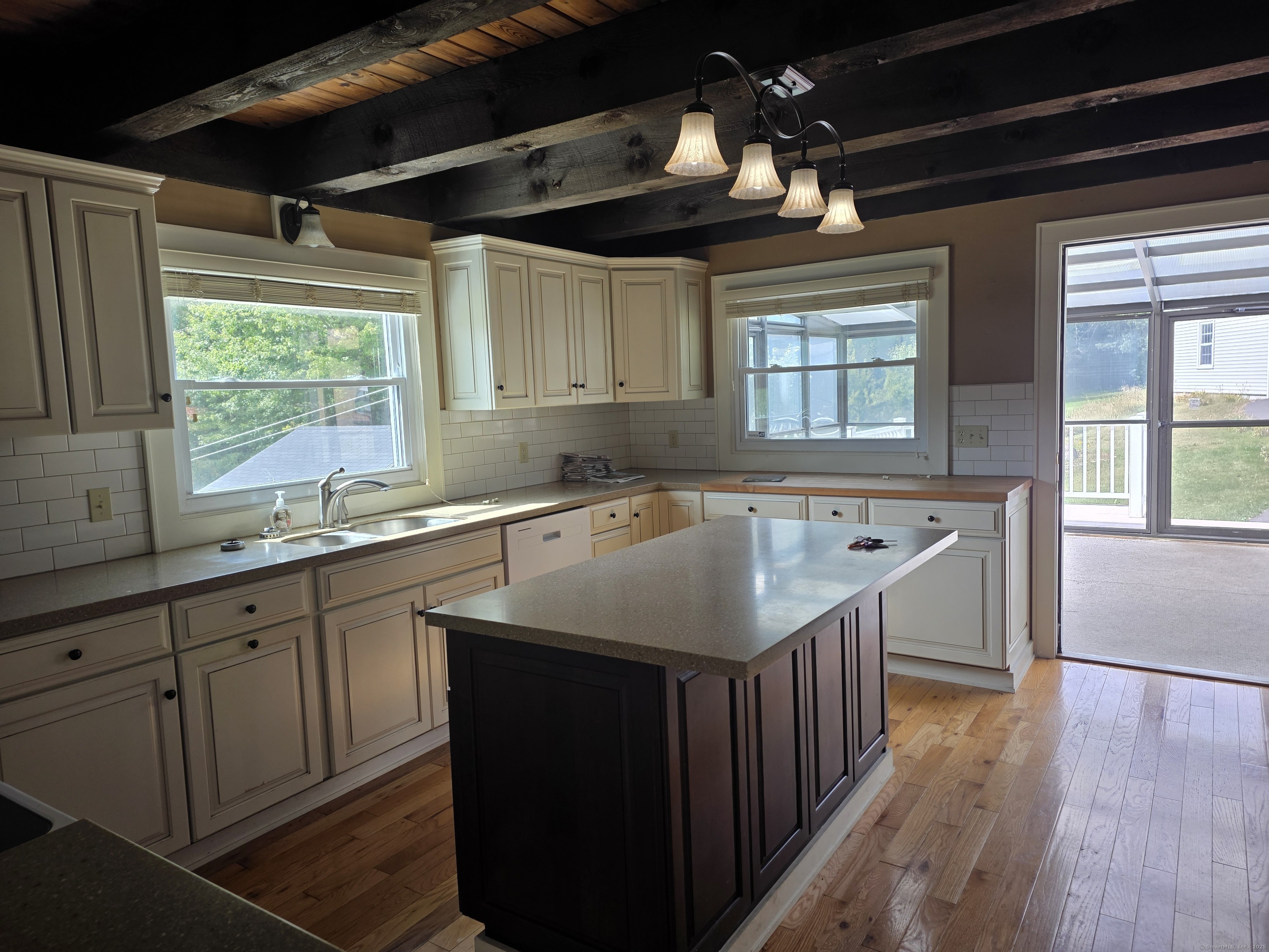 70 Colebrook Road Norfolk, CT 06058 - Photo 9 of 23 a kitchen with a sink window and cabinets