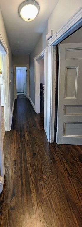74 Sydney Street, Unit 2 Boston, MA 02125 - Photo 4 of 28 a view of an empty room with wooden floor and a window