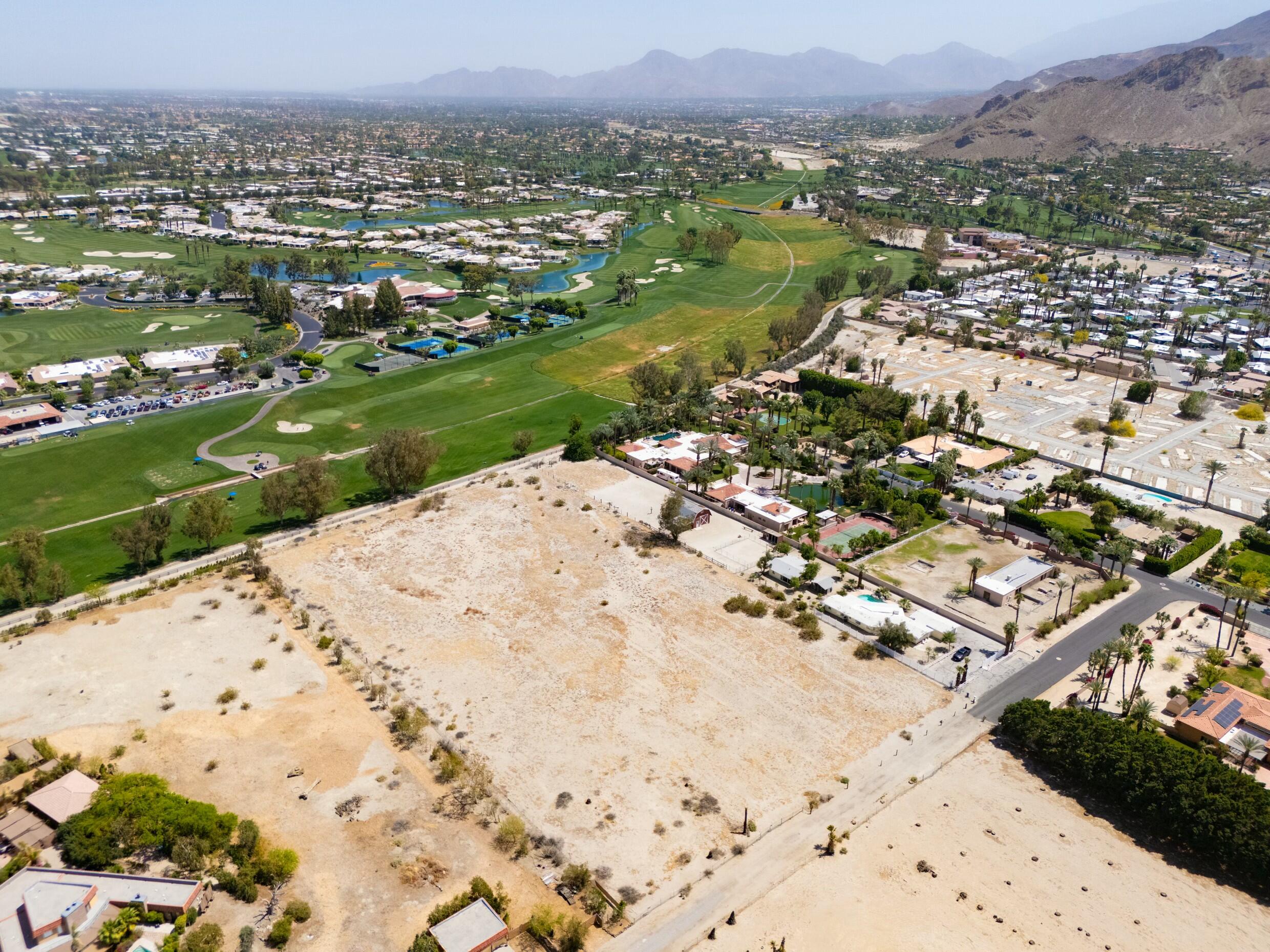 0 Kelly Lane Rancho Mirage, CA 92270 - Photo 3 of 9 an aerial view of a house with a yard and lake view