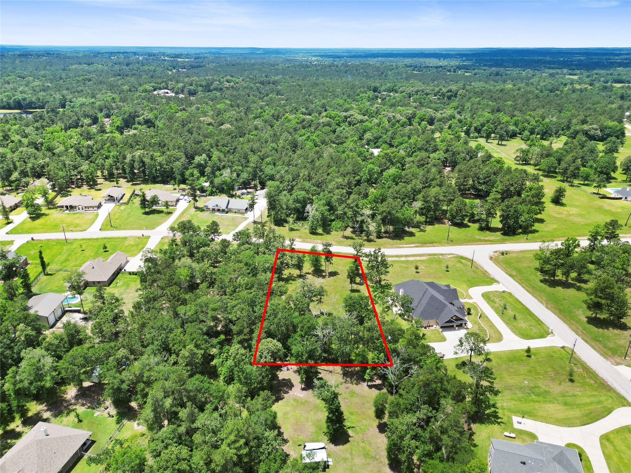 0 Dahlia Road Huntsville, TX 77320 - Photo 3 of 9 a view of a swimming pool with a yard