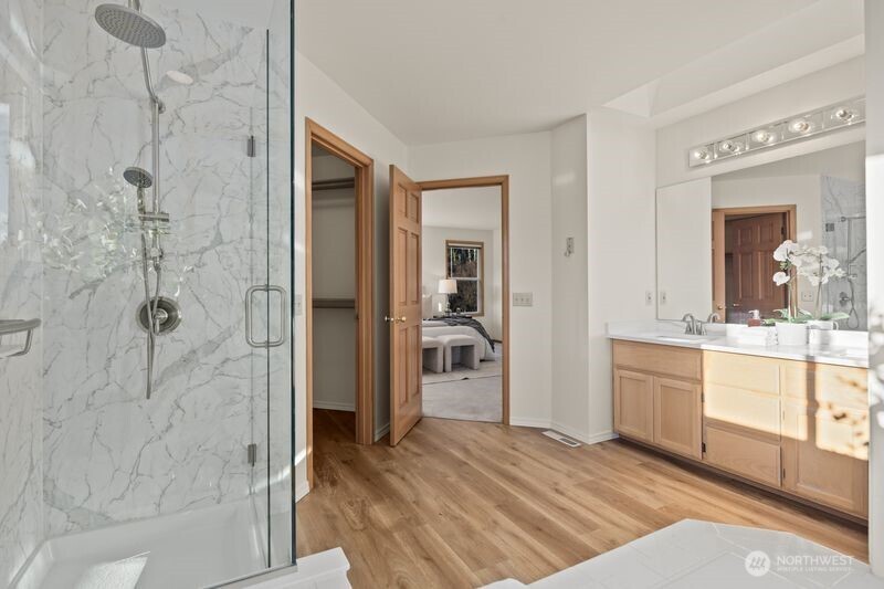 14610 Southeast 184th Place Renton, WA 98058 - Photo 15 of 31 a bathroom with a granite countertop shower a sink and a mirror