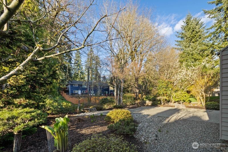 14610 Southeast 184th Place Renton, WA 98058 - Photo 28 of 31 a view of a yard with plants and trees