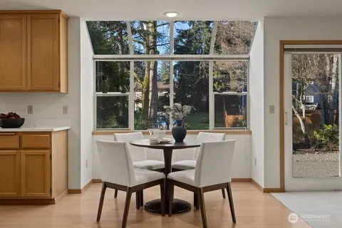a dining room with furniture and window