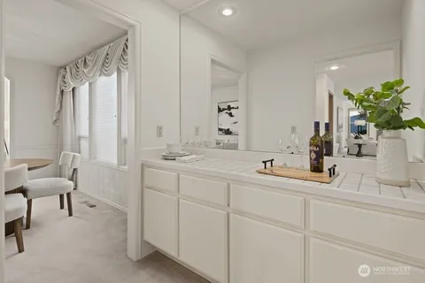 a bathroom with a double vanity sink and a mirror