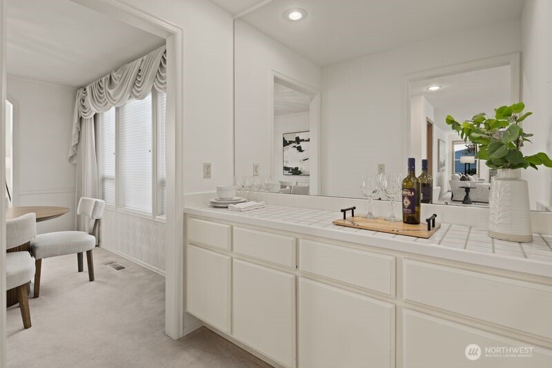 14610 Southeast 184th Place Renton, WA 98058 - Photo 9 of 31 a bathroom with a double vanity sink and a mirror