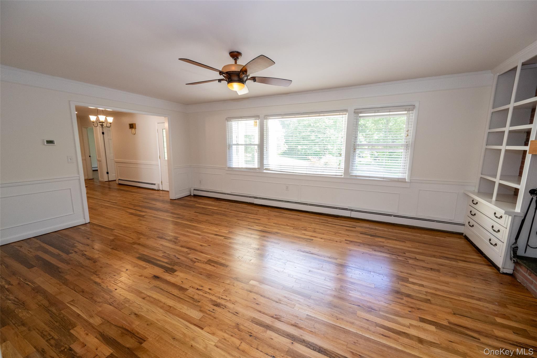 136 Foggintown Road Brewster, NY 10509 - Photo 21 of 50 wooden floor in an empty room with a window
