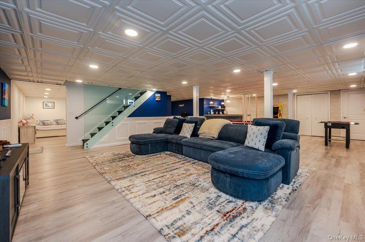 525 Rocky Point Road East Marion, NY 11939 - Photo 14 of 48 a living room with furniture and a wooden floor