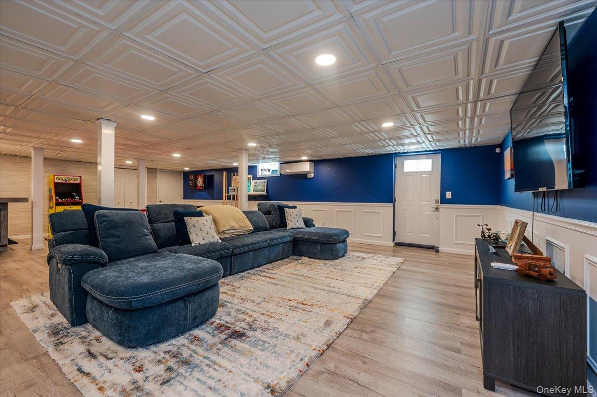 525 Rocky Point Road East Marion, NY 11939 - Photo 15 of 48 a living room with furniture and a wooden floor