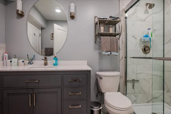 a bathroom with a toilet sink and shower