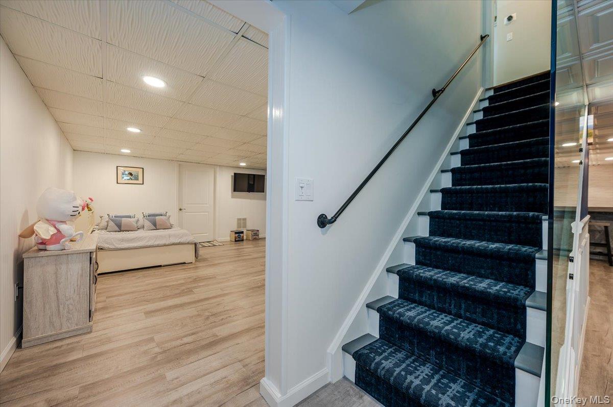 525 Rocky Point Road East Marion, NY 11939 - Photo 21 of 48 a living room with furniture and wooden floor