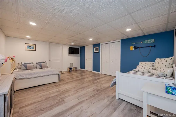 a spacious bedroom with a bed and a couch