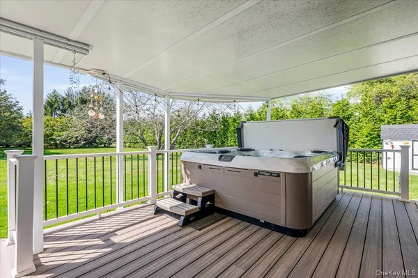 a view of house with deck outdoor seating and yard