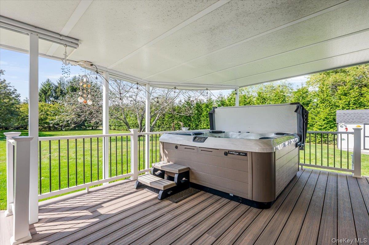 525 Rocky Point Road East Marion, NY 11939 - Photo 27 of 48 a view of house with deck outdoor seating and yard