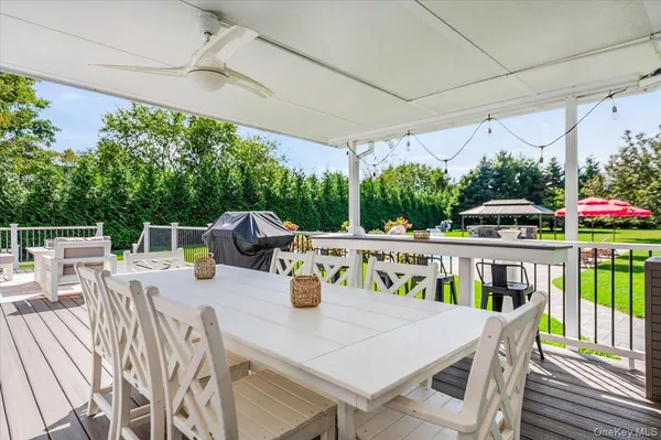 a view of an outside dining space with furniture