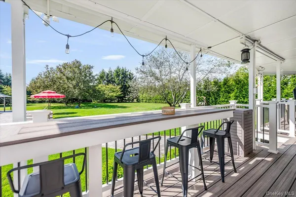a view of a chairs and table in patio